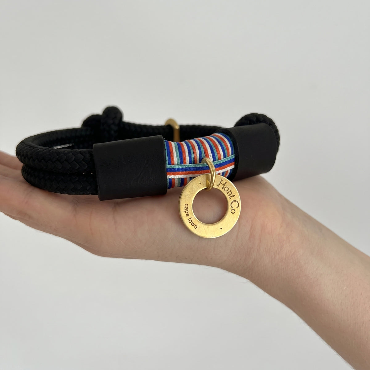 The Seapoint Social Slip Collar in Noir — black braided rope with striped centre and brass Hont Co. tag