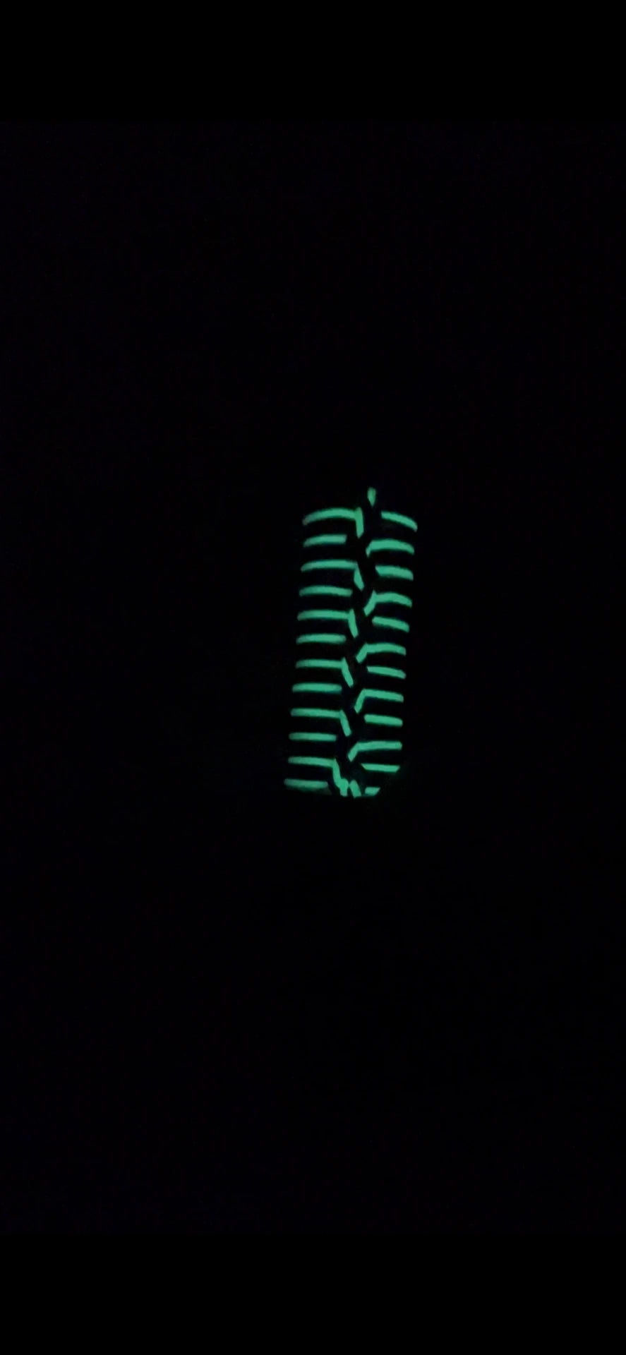 The Seapoint Social Collar glowing in the dark — luminous fibres visible at night